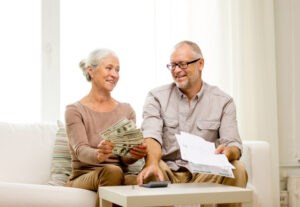 "Two senior adults are discussing paying for senior living options in Yukon, OK "